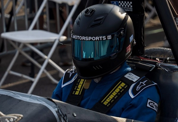 Why does racing driver fatigue affect late performance?