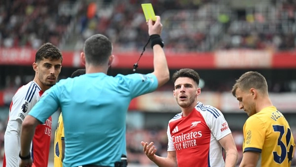 How does referee card bias affect football betting?